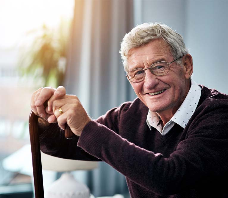 man with cane smiling