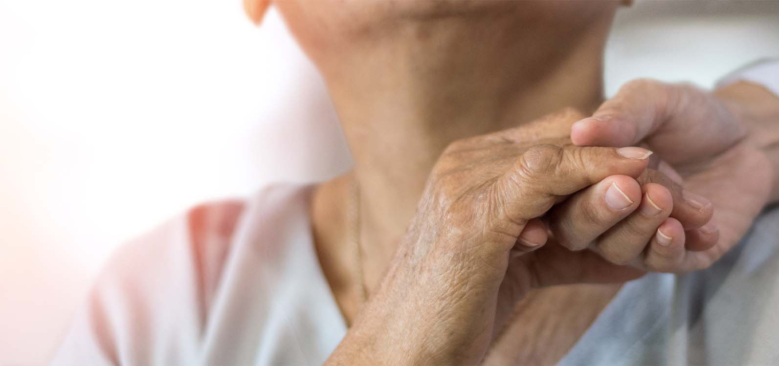 woman with hand on shoulder